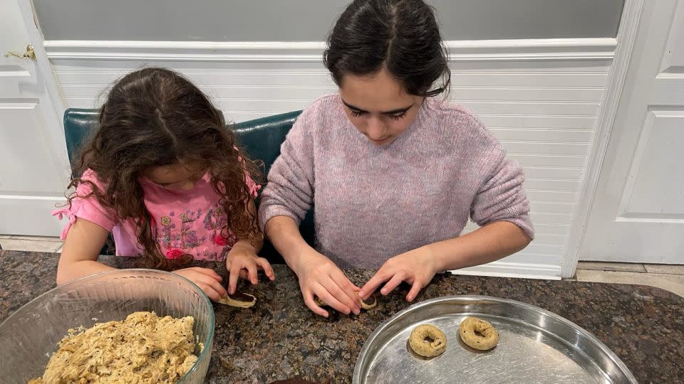 Ahead of Eid, El-Haddad and her daughters prepare ka'ik, traditional ring-shaped cookies stuffed with date paste. - Laila El-Haddad