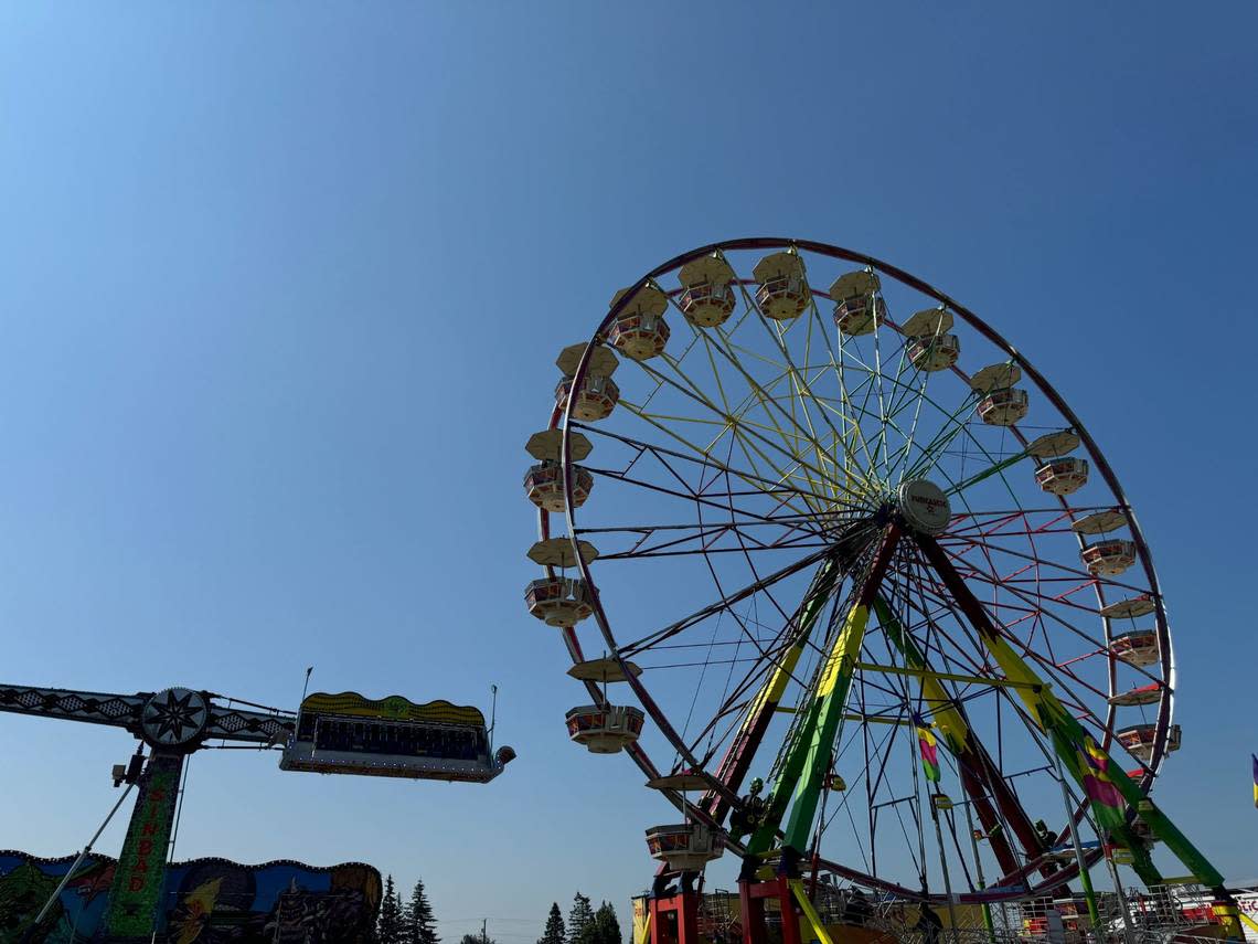 A ferris wheel and swinging carnival ride at The Northwest Washington Fairgrounds at 1775 Front St. in Lynden, Wash. on August 7, 2024.