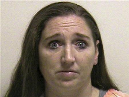 Megan Huntsman is shown in this booking photo provided by the Pleasant Grove County Jail in Pleasant Grove, Utah April 13, 2014. REUTERS/Pleasant Grove County Jail/Handout via Reuters