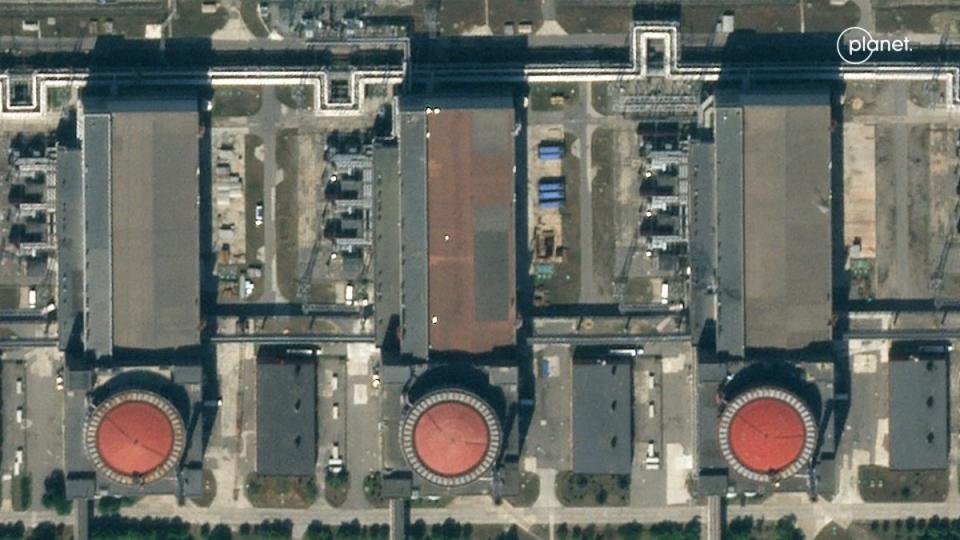 Five white shapes are seen topping Zaporizhzhia power plant (Planet Labs PBC)