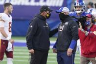 Washington Football Team's Ron Rivera, left, talks to New York Giants' Joe Judge, right, after an NFL football game Sunday, Oct. 18, 2020, in East Rutherford, N.J. The Giants won 20-19. (AP Photo/John Minchillo)