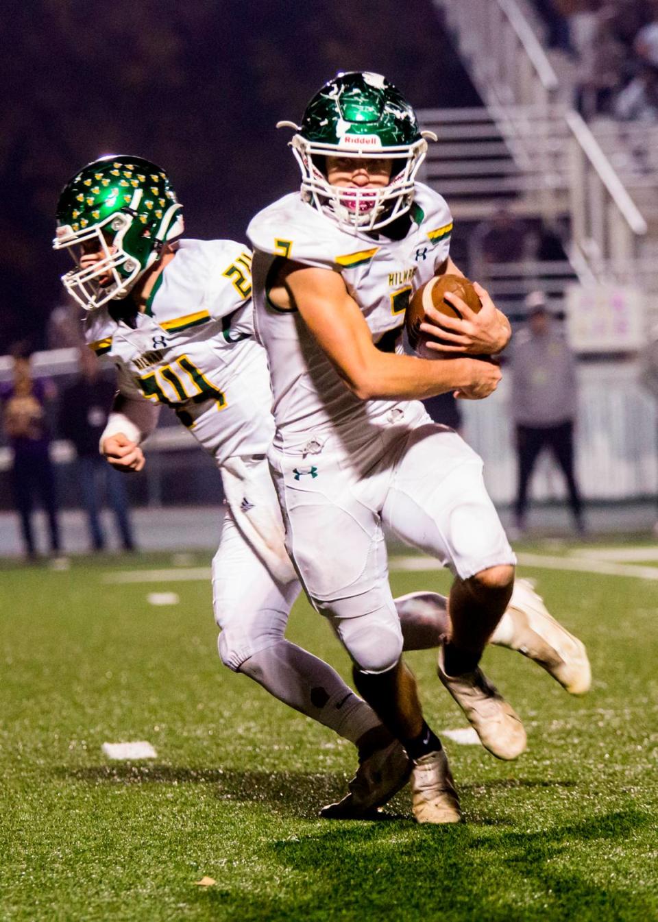 Hilmar Highs Noble Santos, 5, gets the handoff from Jason Pimentel, 24, as he goes for yards. Escalon High School took on Hilmar High football during the 2021 CIF Sac-Joaquin Football Playoffs - Division V at Saint Mary’s High School in Stockton, Ca. Escalon came out on top as the champions with a 20-13 win over Hilmar.