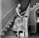 <p>The actress welcomes cameras into the foyer of her Los Angeles home, while looking chic in a floral full skirt dress. </p>