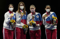 Gold medalists from the Russian Olympic committee celebrate on the podium of the women's Foil team final at the 2020 Summer Olympics, Thursday, July 29, 2021, in Chiba, Japan. (AP Photo/Hassan Ammar)