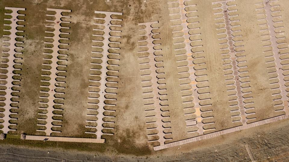 FILE - Boat docks sit on dry land at the Browns Ravine Cove area of drought-stricken Folsom Lake, in Folsom, Calif., on May 22, 2021. Months of winter storms have replenished California's key reservoirs after three years of punishing drought. (AP Photo/Josh Edelson, File)