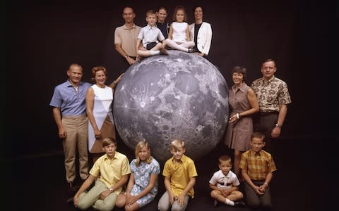 The Apollo 11 astronauts: Buzz Aldrin (left), Michael Collins (top) and Neil Armstrong (right), photographed with their wives and children - Credit: GETTY IMAGES