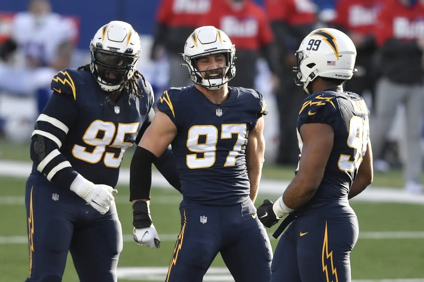 Los Angeles Chargers defensive end Joey Bosa (97) celebrates after sacking Buffalo Bills quarterback Josh Allen.