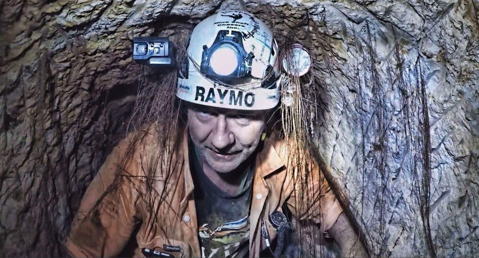 Gold mine shaft explore Ray Shaw inside mine shaft. 