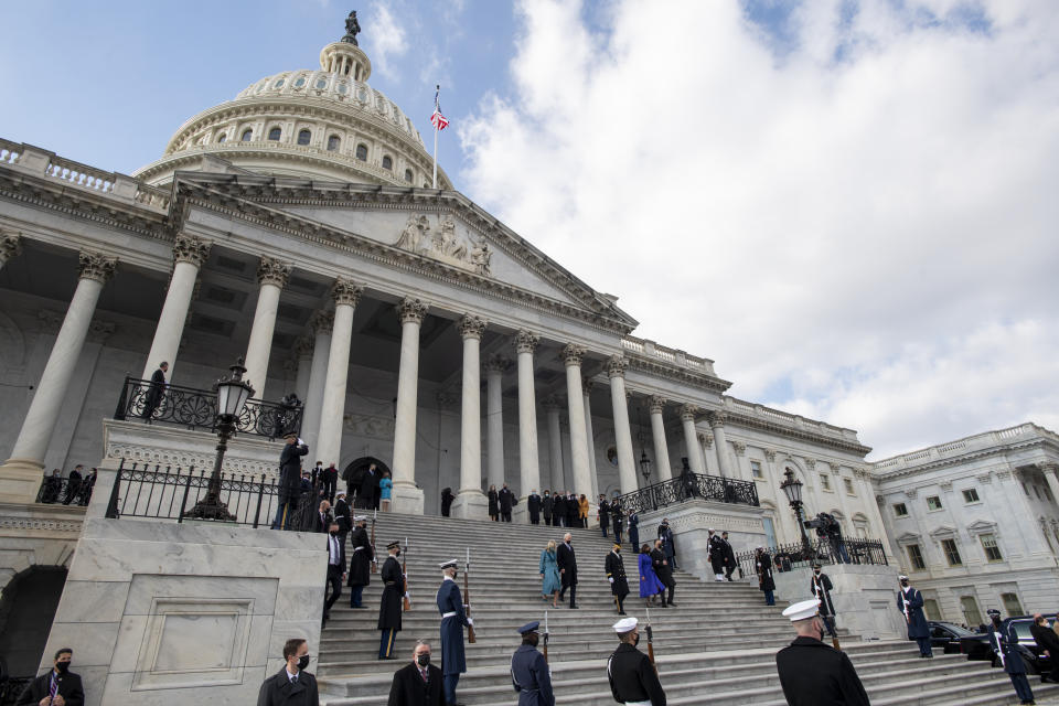 President Joe Biden, first lady Jill Biden, Vice President Kamala Harris and her husband Douglas Emhoff walk down the steps of the U.S. Capitol after they were sworn into office during the inauguration, Wednesday, Jan. 20, 2021, in Washington.(Rod Lamkey/Pool Photo via AP)