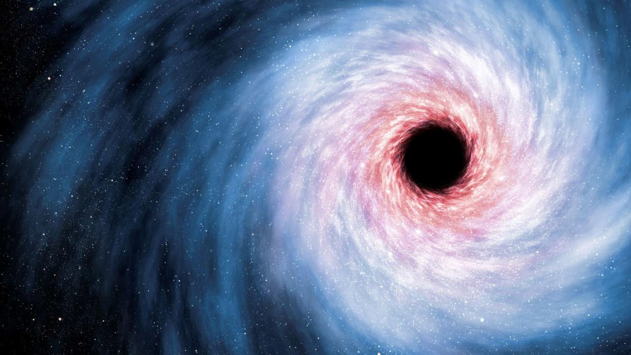  Artist's illustration of a supermassive black hole shows a large circular black void on the right with swirls of blue, pink and orange gathering toward the center.  