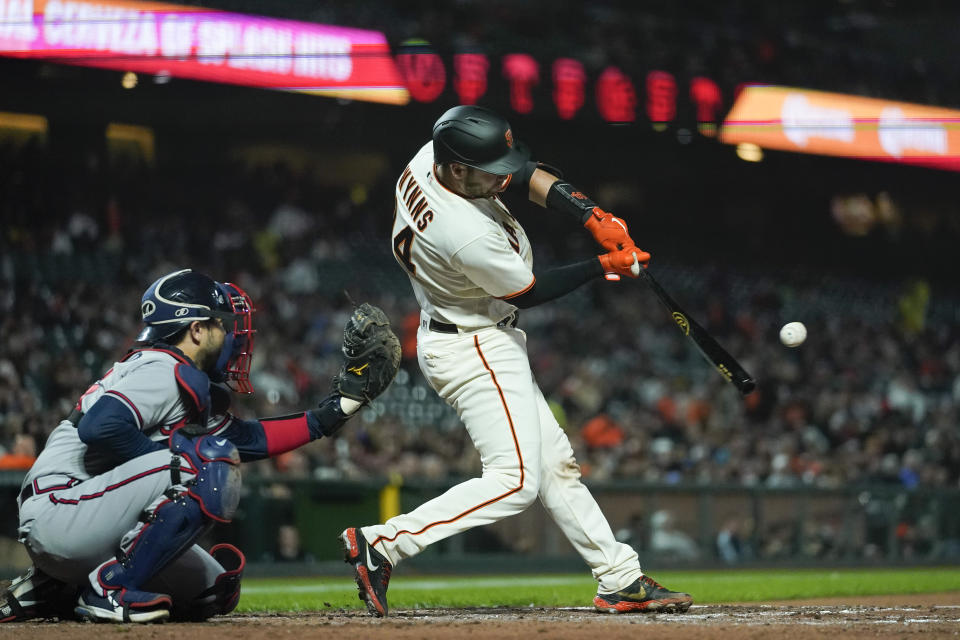 San Francisco Giants' Austin Wynns hits a single against the Atlanta Braves during the fourth inning of a baseball game in San Francisco, Monday, Sept. 12, 2022. (AP Photo/Godofredo A. Vásquez)