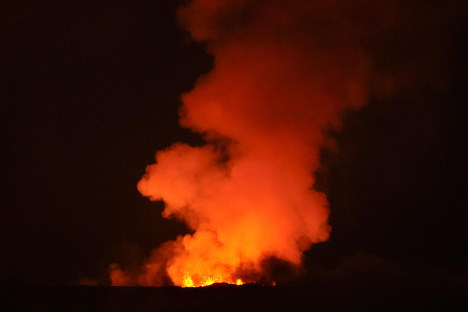 The Mauna Loa volcano erupts Saturday, Dec. 3, 2022, near Hilo, Hawaii. (AP Photo/Gregory Bull)