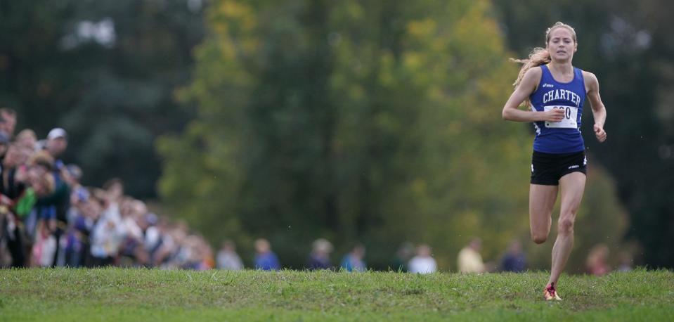 Julie Macedo of Charter runs on the final stretch of the Joe O'Neill Invitational at Bellevue State Park. Macedo has run the fastest cross country 5k on Delaware soil.