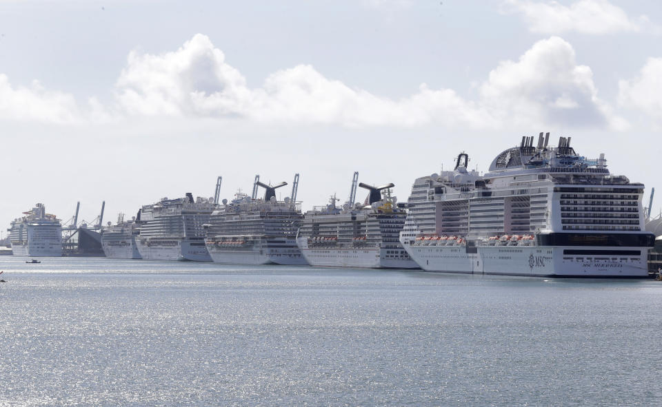 Cruise ships are docked at PortMiami, Tuesday, March 31, 2020, in Miami. (AP Photo/Wilfredo Lee)