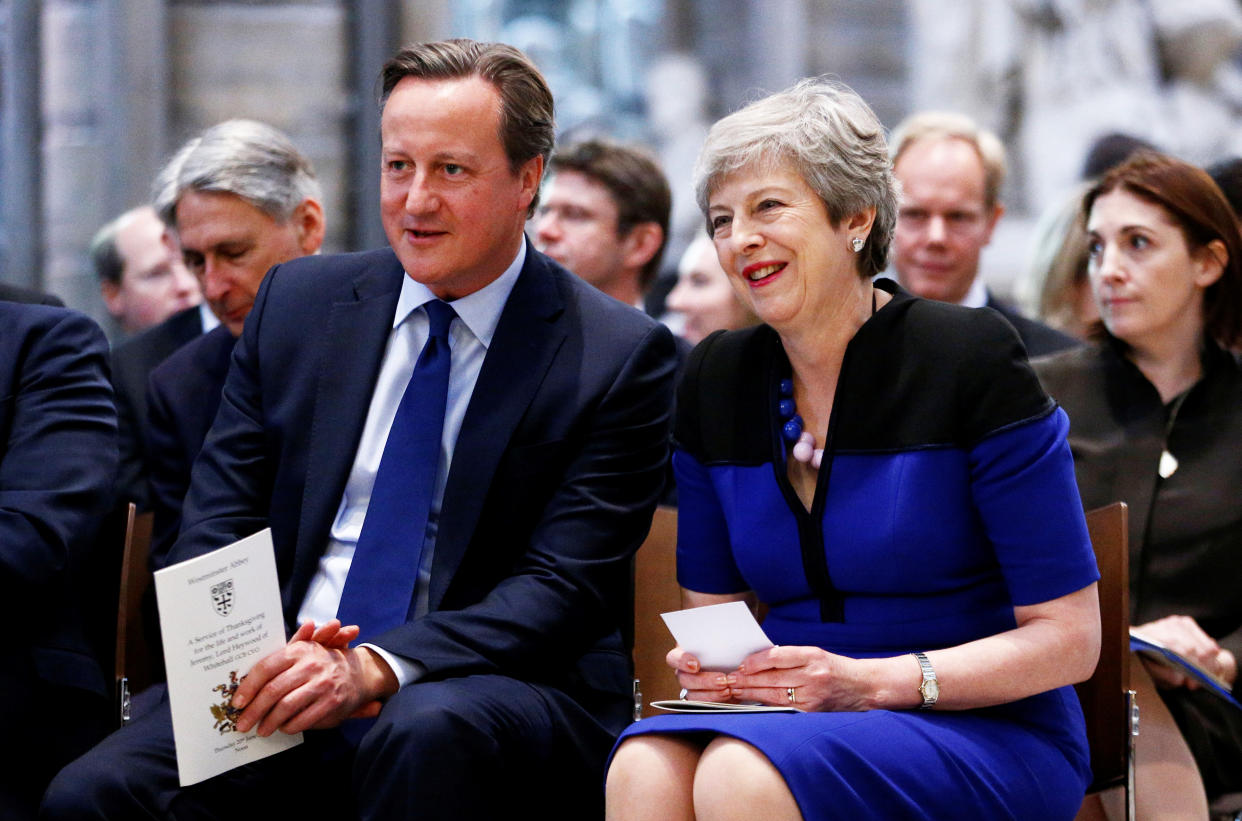 Prime Minister Theresa May and her predecessor David Cameron during a service of thanksgiving for the life and work of former Cabinet Secretary Lord Heywood at Westminster Abbey in London.