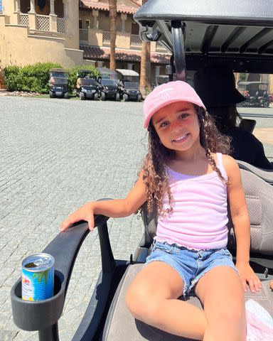 <p>Rob Kardashian/Instagram</p> Dream Kardashain poses in a golf cart