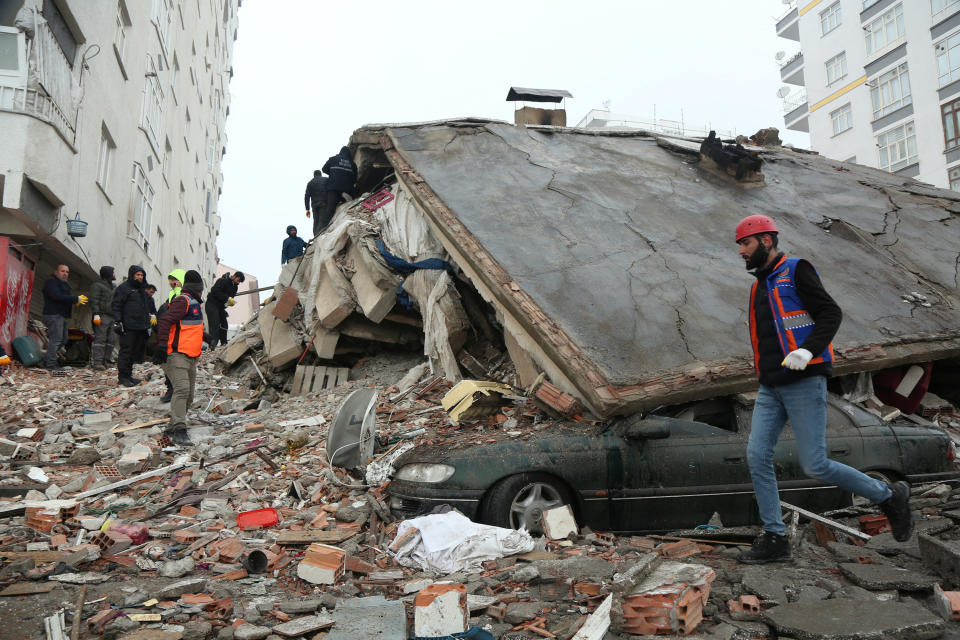 Rescuers search for survivors under the rubble following an earthquake in Diyarbakir, Turkey.