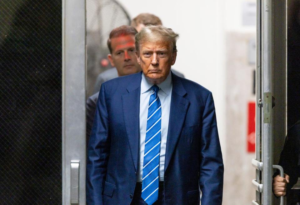 Donald Trump appears in a Manhattan criminal courthouse on Tuesday (AP)