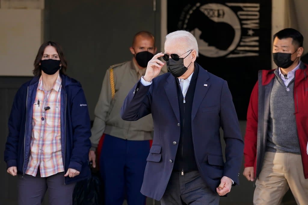 US President Joe Biden walks to greet members of the United States Coast Guard (AP)