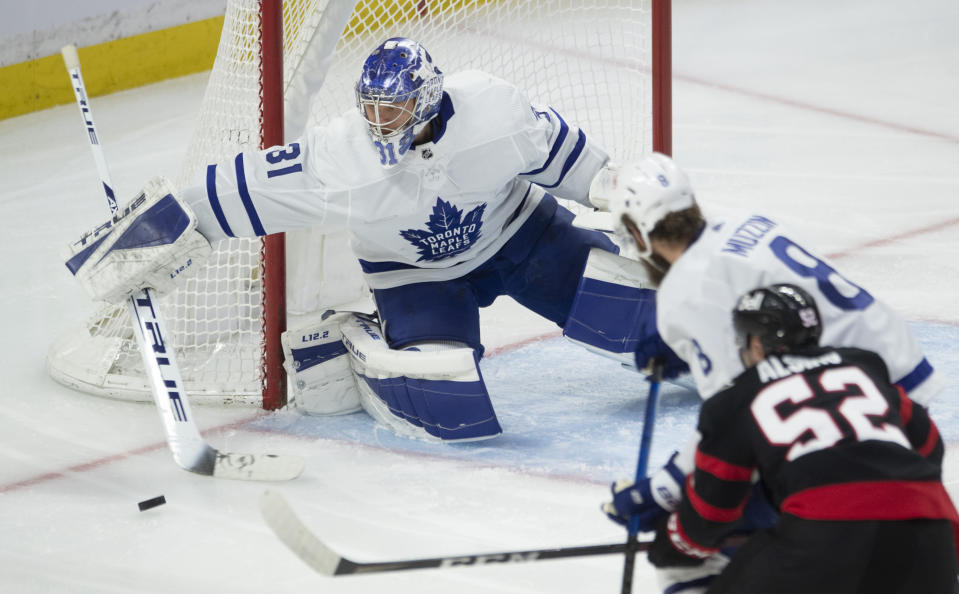 Toronto Maple Leafs goaltender Frederik Andersen deflects the puck wide of the net during the second period of an NHL hockey game against the Ottawa Senators on Wednesday, May 12, 2021, in Ottawa, Ontario. (Adrian Wyld/The Canadian Press via AP)