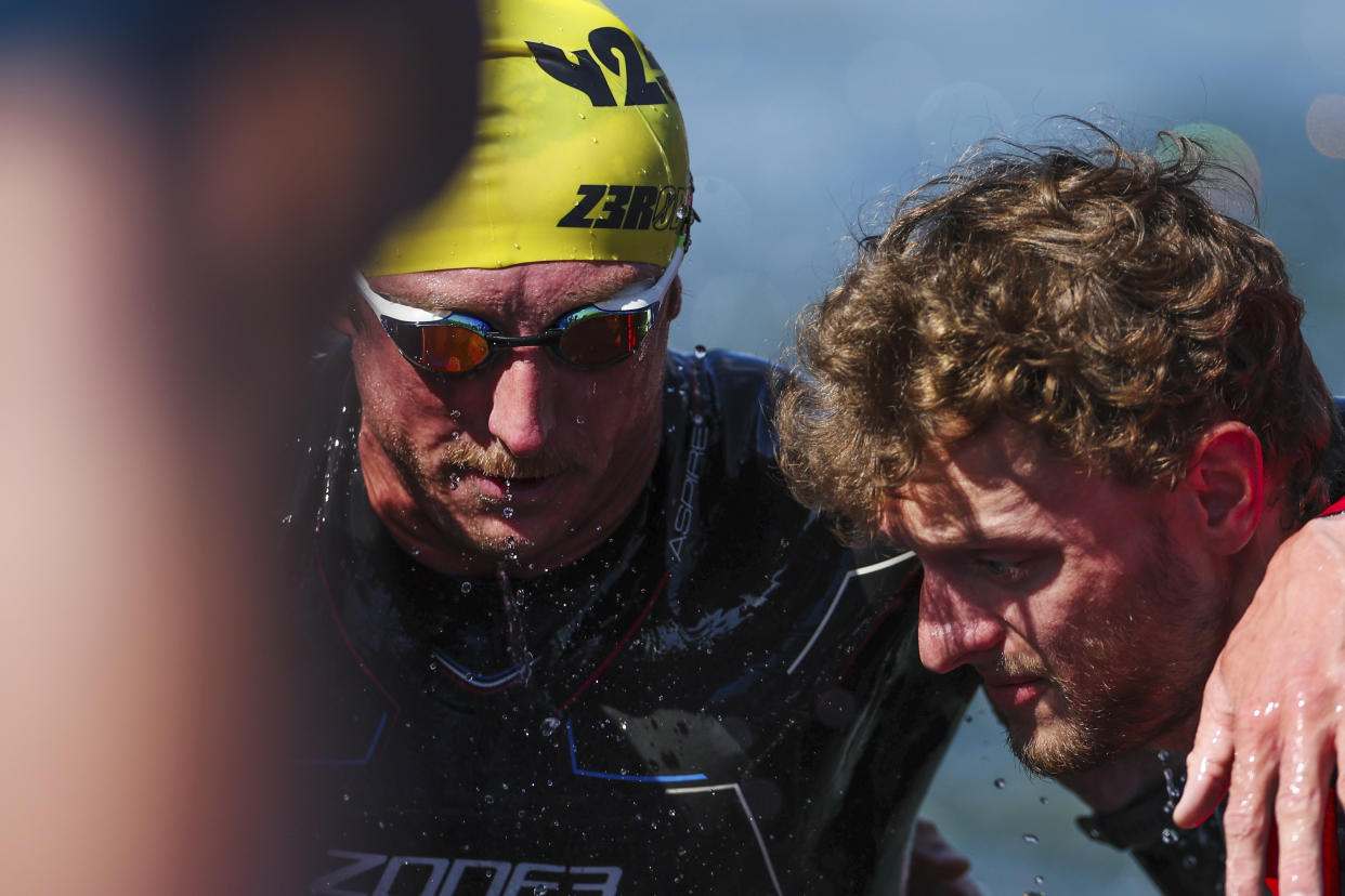 Carson Clough, of the United States, prepares for the cycling portion of the PTS4 Triathlon at the 2024 Paralympics, Monday, Sept. 2, 2024 in Paris, France. (AP Photo/Caleb Craig)