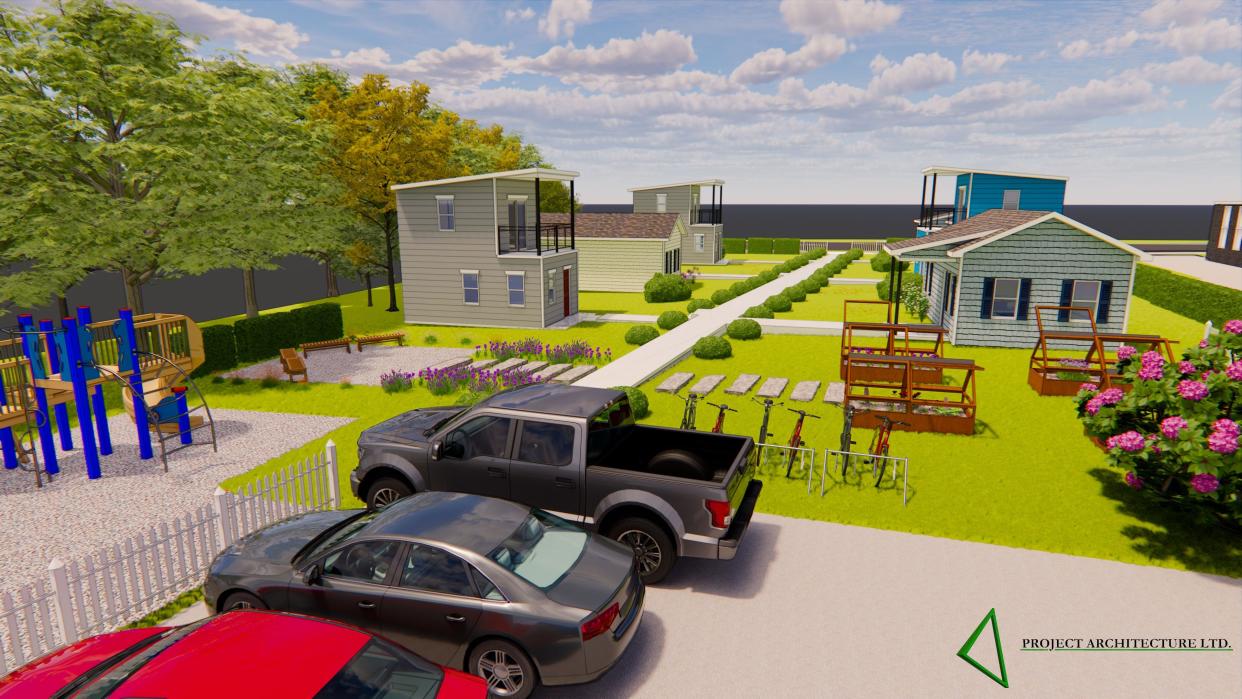 A rendering of the proposed tiny home village includes a playground, bike racks and six tiny homes.