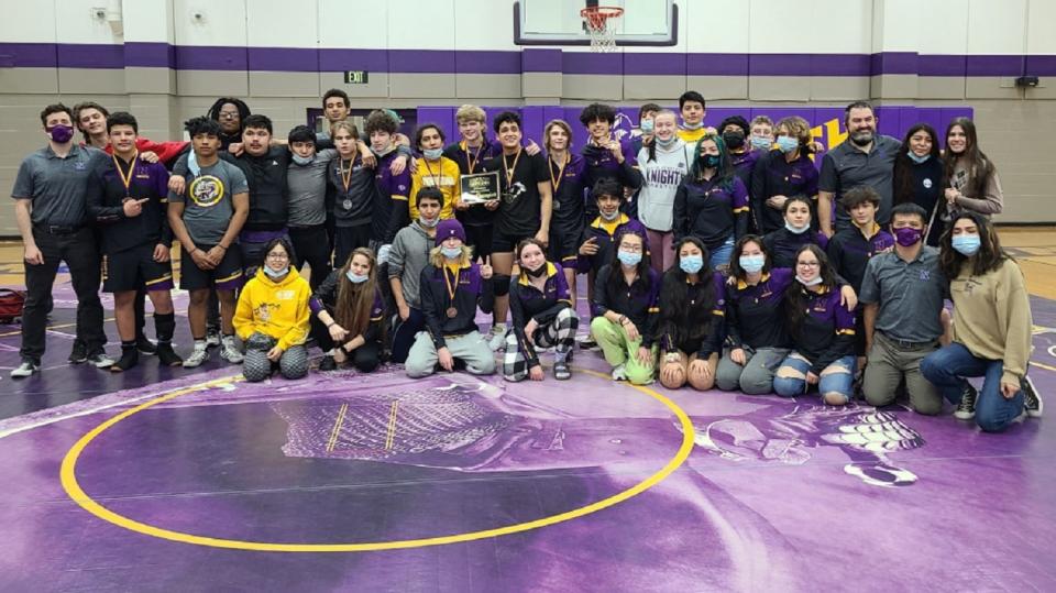 North Henderson's wrestling team poses after winning the Mountain 7 Conference tournament title on Saturday at Tom Pryor Gymnasium at North.