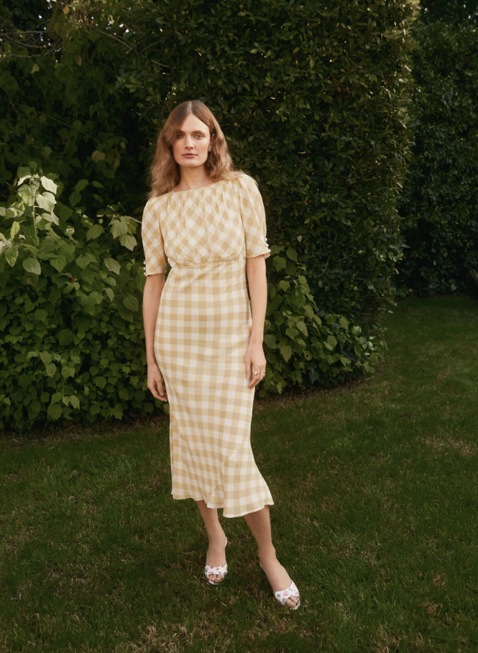 model wearing yellow and white gingham midi dress, Ozzy Dress (Photo via Reformation)