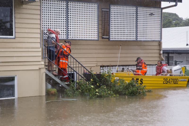 SES volunteers are seen rescuing residents in Rosslea. Source: Reuters
