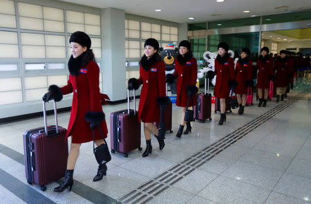 North Korean cheering squads arrive at the Korean-transit office near the Demilitarized Zone in Paju, South Korea, February 7, 2018. REUTERS/Ahn Young-joon/Pool