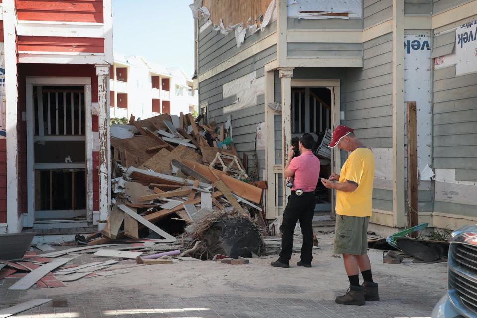 An insurance adjuster reviews a property in Mexico Beach, Fla., after Hurricane Michael in 2018. The storm caused about $25 billion in damage. <a href="https://www.gettyimages.com/detail/news-photo/an-insurance-adjuster-looks-over-damage-to-the-home-of-news-photo/1052458328?adppopup=true" rel="nofollow noopener" target="_blank" data-ylk="slk:Scott Olson/Getty Images;elm:context_link;itc:0;sec:content-canvas" class="link ">Scott Olson/Getty Images</a>