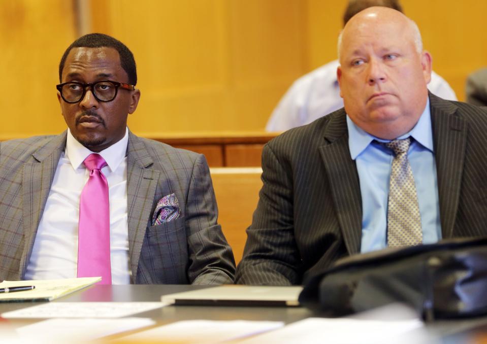 State Rep. Brian Banks, 39, D-Harper Woods, left,  is facing three felonies and one misdemeanor in connection to a $3,000 loan he took out in 2010 from a Detroit credit union. Banks and his attorney Ben Gonek listen as Judge Deborah Langston finds sufficient evidence in court on Aug. 9, 2016, at Frank Murphy Hall of Justice in Detroit to bind over the charges against him for a trial.