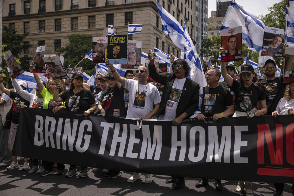 Family members of Israeli hostages march during the annual Israel Day Parade on Fifth Avenue on Sunday, June 2, 2024, in New York. (AP Photo/Yuki Iwamura)