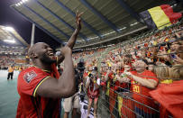 Belgium's Romelu Lukaku, left, celebrates after winning the World Cup 2022 group E qualifying soccer match between Belgium and the Czech Republic at King Baudouin stadium in Brussels, Sunday, Sept. 5, 2021. (AP Photo/Olivier Matthys)