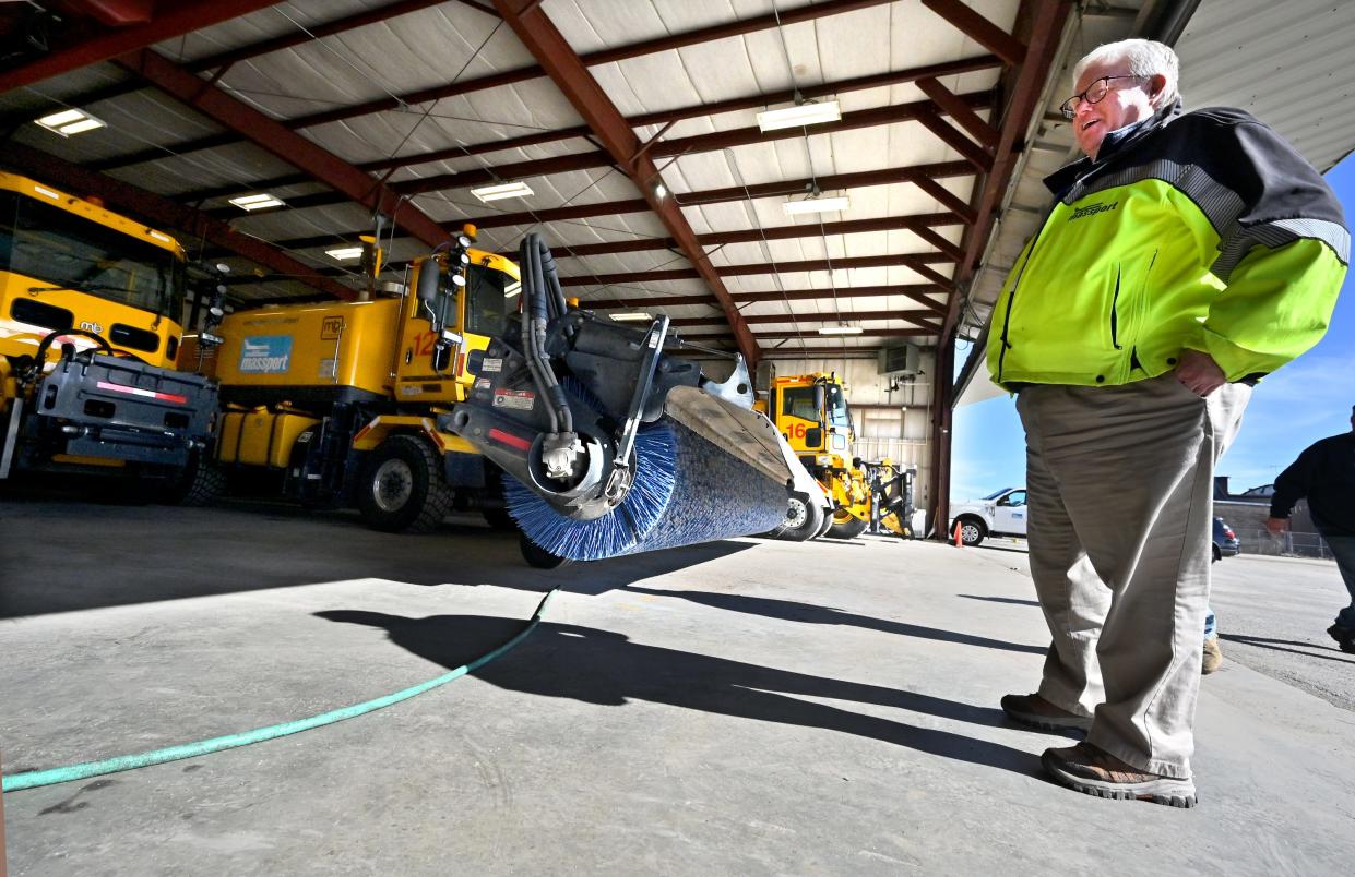 Worcester Regional Airport Director Andy Davis surveys some of the airport's snow removal equipment Monday.