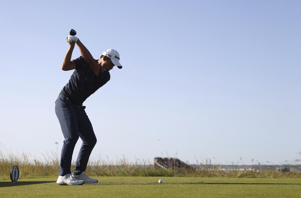 United States' Collin Morikawa plays his tee shot on the 11th hole during the third round of the British Open Golf Championship at Royal St George's golf course Sandwich, England, Saturday, July 17, 2021. (AP Photo/Peter Morrison)