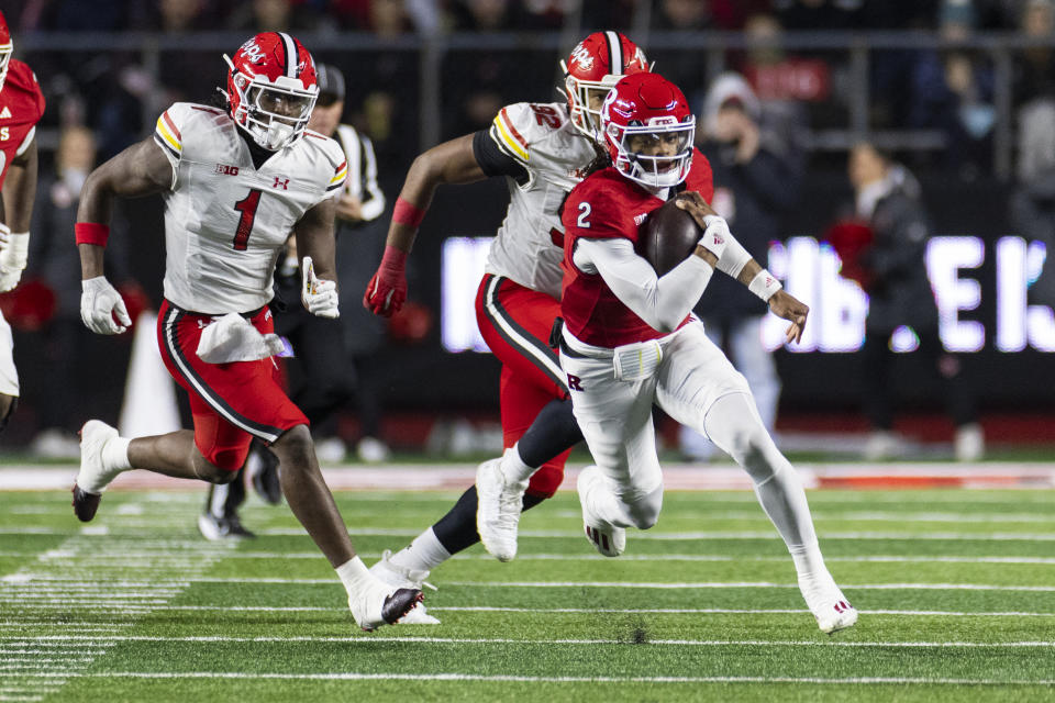 Rutgers quarterback Gavin Wimsatt (2) runs the ball in front of Maryland linebacker Jaishawn Barham (1) and defensive lineman Christian Teague (92) in the first half of an NCAA college football game, Saturday, Nov. 25, 2023, in Piscataway, N.J. (AP Photo/Corey Sipkin)