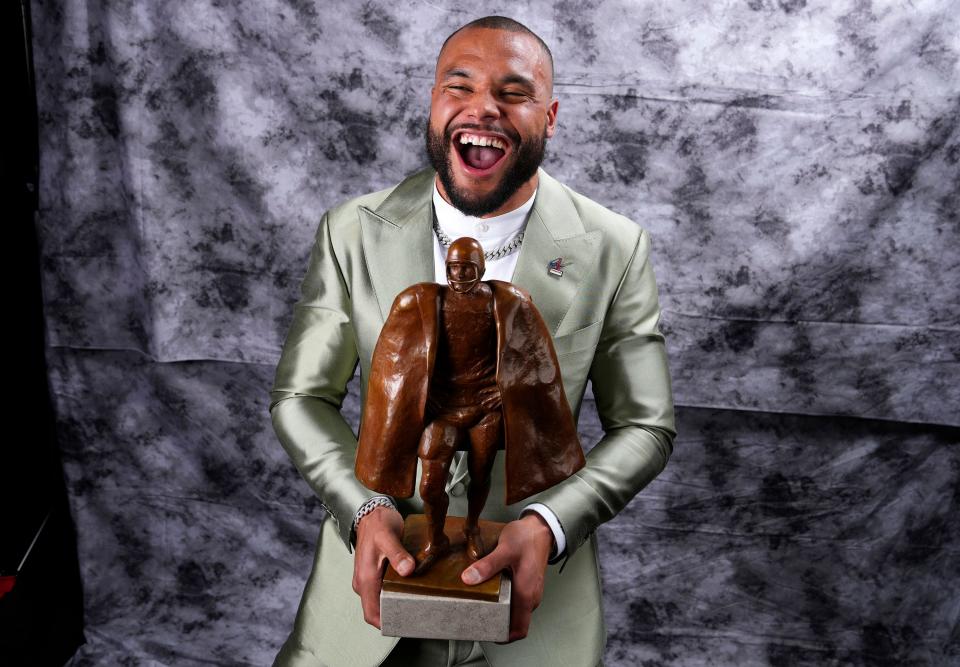 Walter Payton Player of the Year Award winner, Dallas Cowboys' Dak Prescott, poses for a photo during the NFL Honors award show ahead of the Super Bowl 57 football game, Thursday, Feb. 9, 2023, in Phoenix.