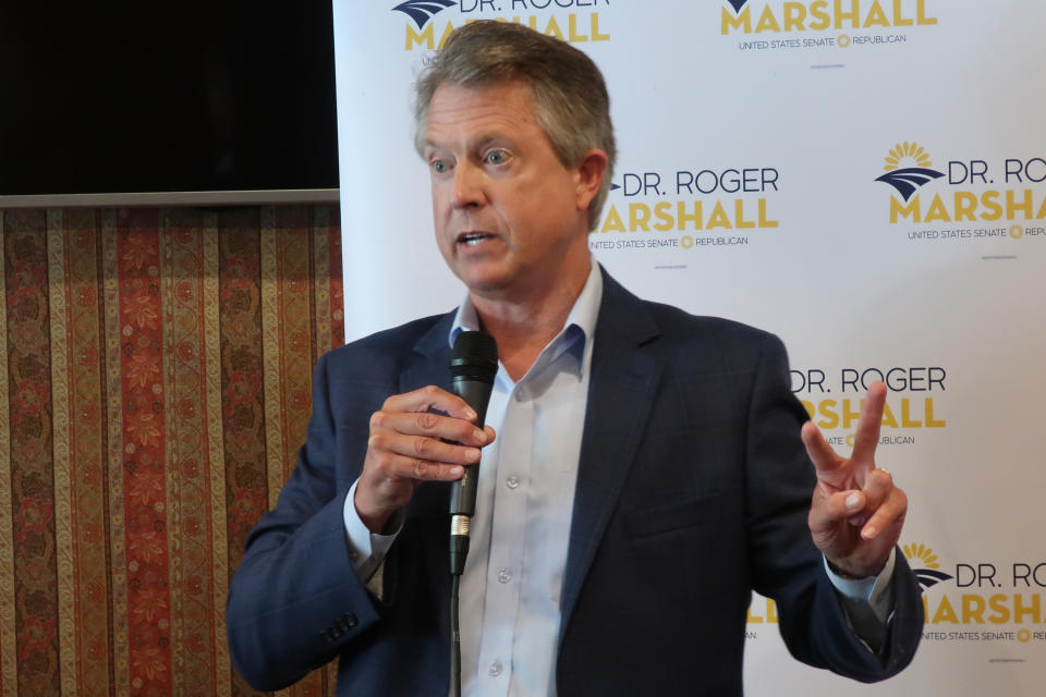 FILE - U.S. Rep. Roger Marshall, R-Kan., speaks to a local Elephant Club meeting in the banquet room of a restaurant in Overland Park, Kan. on Aug. 18, 2020. Marshall and Democrat state Sen. Barbara Bollier will meet in their first debate of their race to replace retiring Sen. Pat Roberts. (AP Photo/John Hanna, File)