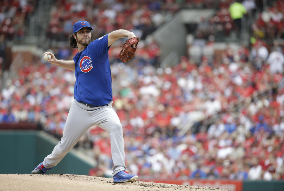 FILE - Chicago Cubs starting pitcher Dan Haren throws during the first inning of a baseball game against the St. Louis Cardinals Monday, Sept. 7, 2015, in St. Louis. Traveling athletes find different ways of dealing with the stress at 35,000 feet. All-Star pitcher Haren used to visit the cockpit on team charters, hoping for some comfort when he became overwhelmed. (AP Photo/Jeff Roberson, File)