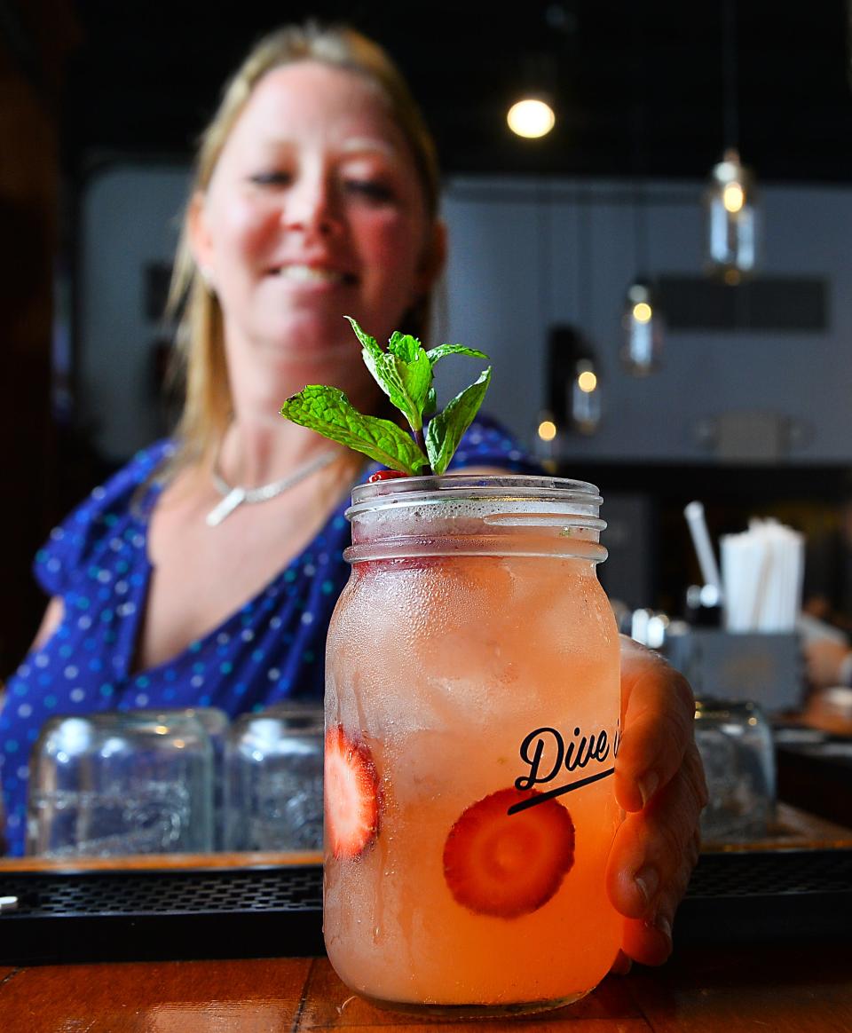 Heather Buesing serves up a specialty cocktail at The Mason Jar.
