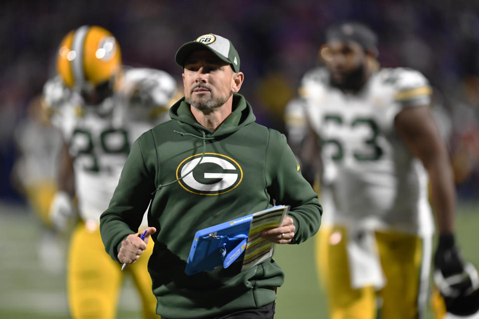 Green Bay Packers head coach Matt LaFleur runs to the locker room at the halftime during an NFL football game against the Buffalo Bills Sunday, Oct. 30, 2022, in Orchard Park. (AP Photo/Adrian Kraus)
