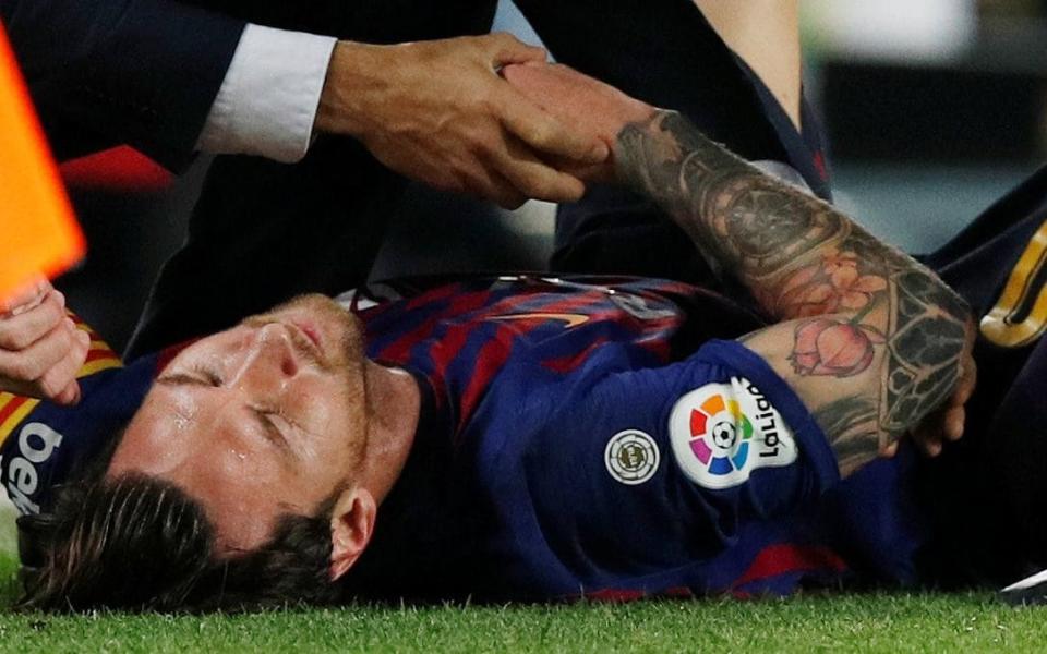 Lionel Messi has fractured the radial bone in his right arm - REUTERS