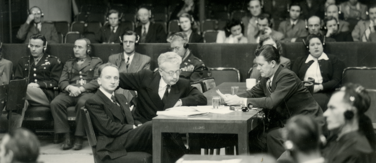 Benjamin Ferencz, sitting at a table during the Einsatzgruppen trial in Nuremberg in 1947.