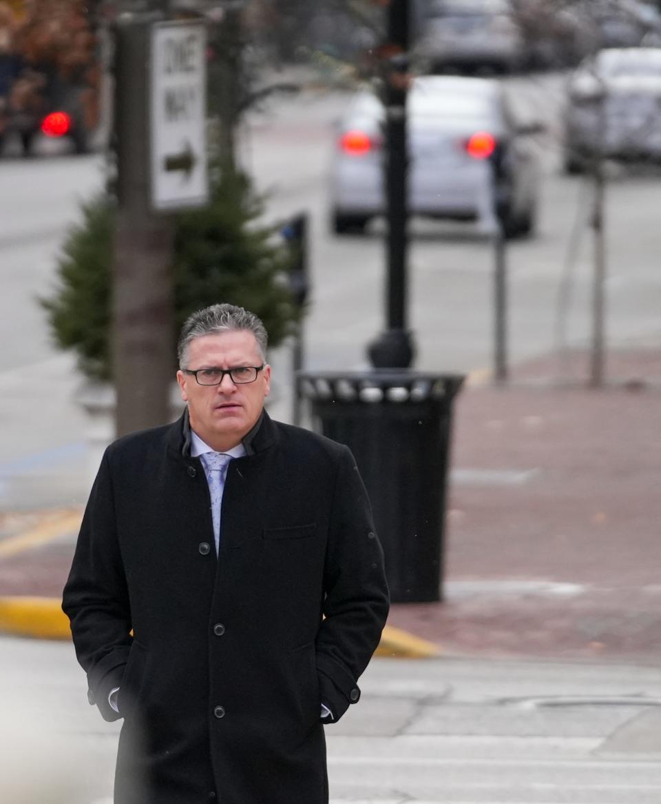 Former state Rep. Sean Eberhart walks toward the U.S. Courthouse in downtown Indianapolis, Tuesday, Nov. 28, 2023. Eberhart pleaded guilty to a conspiracy charge for influencing a 2019 gaming bill in exchange for a promised job paying $350,000.