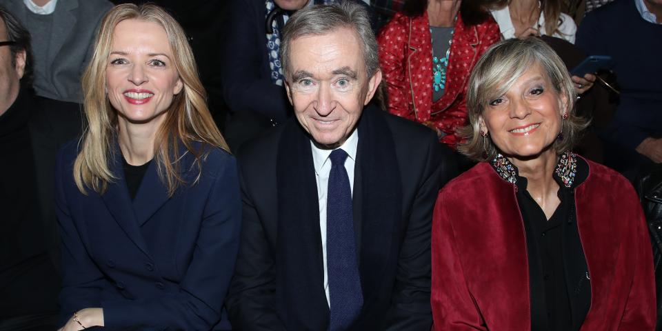 Louis Vuitton's executive vice president Delphine Arnault, Owner of LVMH Luxury Group Bernard Arnault and his wife Helene Arnault attend the Dior show as part of the Paris Fashion Week Womenswear Fall/Winter 2020/2021 on February 25, 2020 in Paris, France.