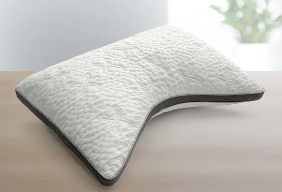 This curved Sleep Number ComfortFit pillow contours to fit your head and neck. (Photo: Sleep Number)