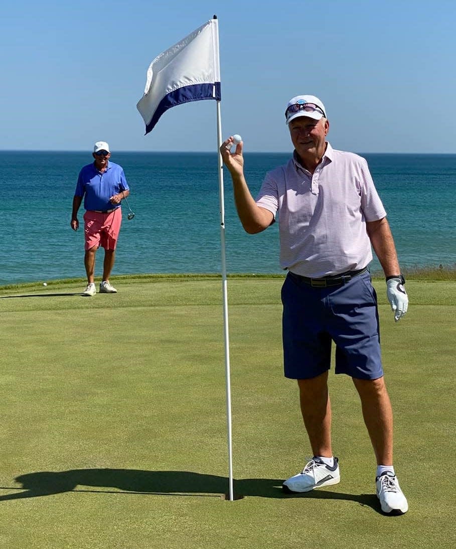 Don Bruce shows off the ball he made a hole-in-one with on the No. 3 hole at Whistling Straights.