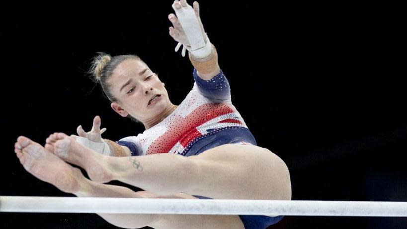 Alice Kinsella performs on the uneven bars