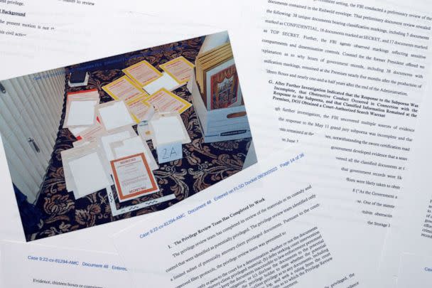 PHOTO: Pages from a Department of Justice court filing on Aug. 30, 2022 are photographed early Wednesday, Aug. 31, 2022. Included in the filing was a FBI photo of documents that were seized during the search.  (Jon Elswick/AP)